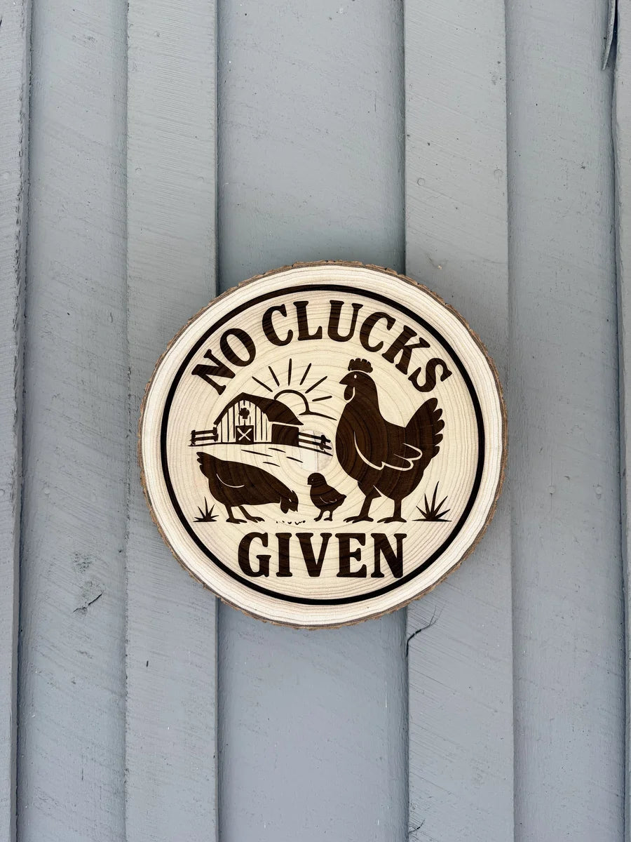 Wood sign no clucks given