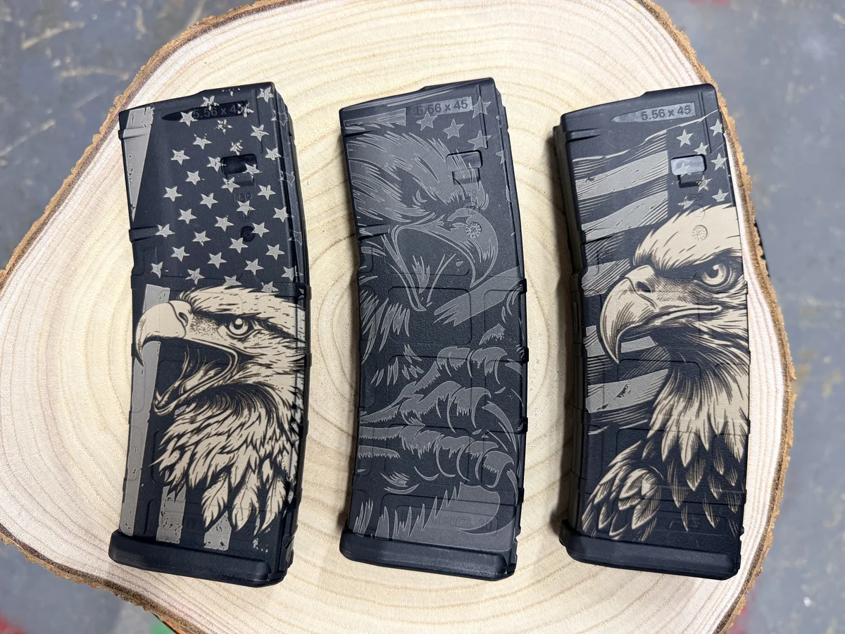 Three custom laser-engraved AR magazines with American eagle design — Apex Coatings & Engraving